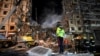 Rescuers work on a residential building destroyed in a Russian missile strike, in Dnipro, eastern Ukraine, Jan. 15, 2023, amid Russia's invasion of its neighbor. 