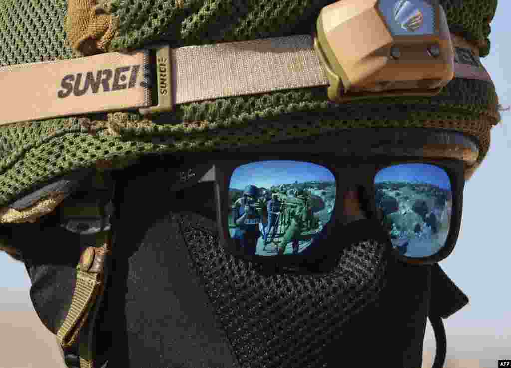 A member of the Israeli security forces is pictured during a protest by Palestinians in Beit Dajan, east of the occupied West Bank city of Nablus, against the establishment of Israeli outposts.