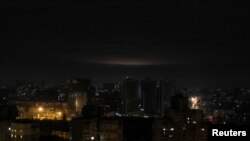 A fireball from an explosion is seen above Kyiv's skyline during Russian drone strikes, on Ukraine's capital, Jan. 1, 2023. 