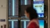 Cancelled Southwest Airlines flights are seen in red on the flight schedules at the Southwest terminal at Los Angeles International Airport, in Los Angeles, California, Dec. 27, 2022.