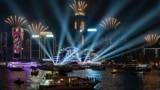 FILE - Fireworks are seen over Victoria Harbour at midnight on New Years Sunday Jan. 1, 2023 in Hong Kong. (AP Photo/Anthony Kwan)