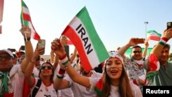 Iran fans celebrate outside Ahmad Bin Ali Stadium after Iran defeated Wales Nov. 25, 2022, in Al Rayyan, Qatar.