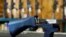 FILE - A bump stock that attaches to a semiautomatic rifle to increase the firing rate is seen at Good Guys Gun Shop in Orem, Utah, Oct. 4, 2017. 