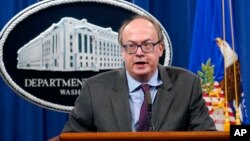 FILE - Jeffrey Clark, then-Assistant Attorney General, speaks during a news conference at the Justice Department in Washington, Sept. 14, 2020. 