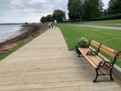 Locals enjoy the view along the Charlottetown waterfront. (Jay Heisler/VOA)