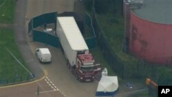 An aerial view of police forensic officers attending to the scene after a truck was found to contain 39 bodies, in Thurrock, South England, Oct. 23, 2019.