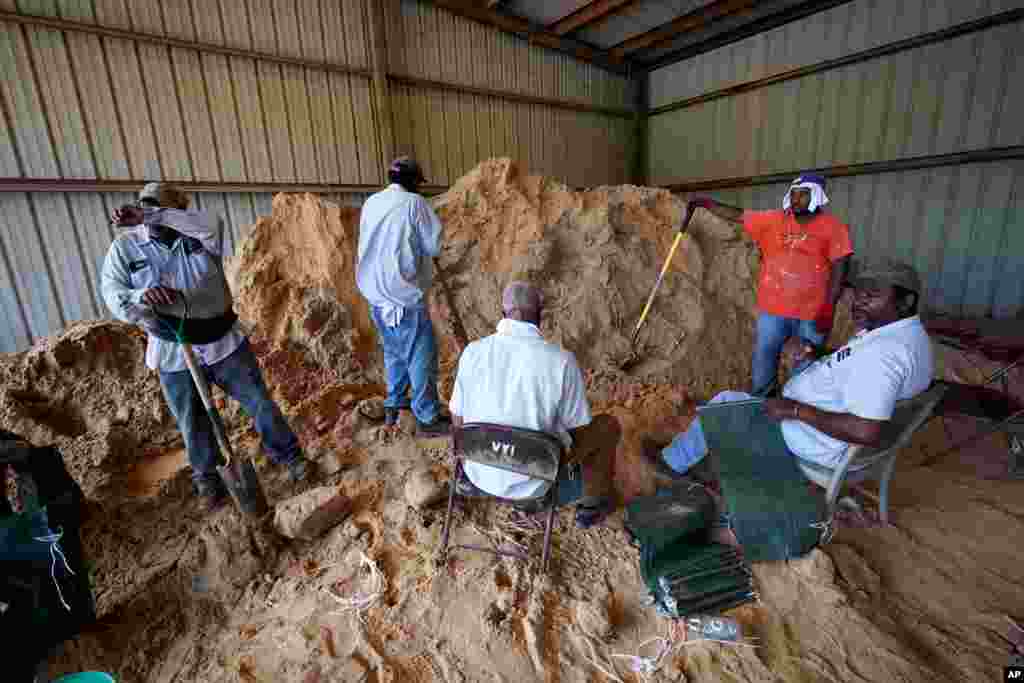 Municipal workers fill sandbags for residents in advance of Hurricane Laura in Abbeville, La., Aug. 25, 2020. 