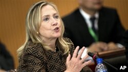 U.S. Secretary of State Hillary Rodham Clinton delivers opening remarks to the Community of Democracies Governing Council at the Ministry of Foreign Affairs Monday, July 9, 2012 in Ulan Bator, Mongolia. (AP Photo/Brendan Smialowski, Pool)