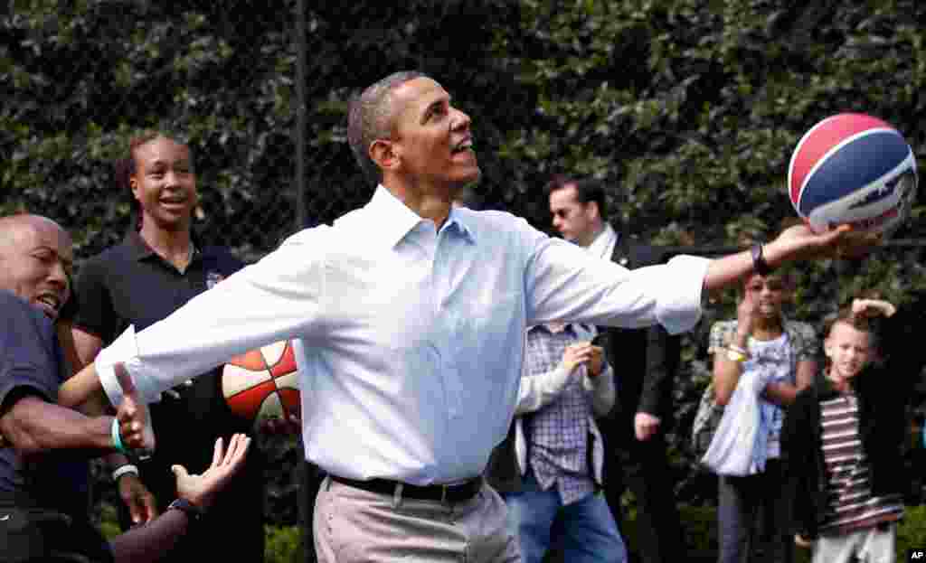 President Obama lays up a shot during the Easter Egg Roll festivities. (Reuters) 