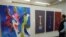 Paintings by graduating student Andrew Tanner on display at the Maryland Institute College of Art in Baltimore. (J. Taboh/VOA) 