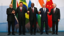 Indian Prime Minister Narendra Modi, China's President Xi Jinping, South Africa's President Cyril Ramaphosa, Russia's President Vladimir Putin and Brazil's President Michel Temer pose for a group picture at the BRICS summit meeting in Johannesburg, South 