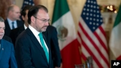 Mexico's Foreign Secretary Luis Videgaray walks to his chair during the U.S.-Mexico bilateral meeting on disrupting transnational criminal organizations at State Department in Washington, Dec. 14, 2017. 