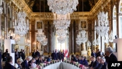 EU leaders get ready to take part in a summit to address the fallout of Russia's invasion of Ukraine at the Palace of Versailles, near Paris, on March 11, 2022. 