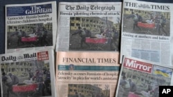 FILE - Front pages of British newspapers published March 10, 2022, show reactions to an airstrike on a maternity hospital in Mariupol, Ukraine, a day earlier.