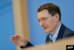 German Health Minister Karl Lauterbach attends a press conference on Germany's COVID-19 pandemic, in Berlin, March 11, 2022.