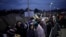 Refugees fleeing Russia's invasion of Ukraine queue at the Medyka border crossing, Poland, March 10, 2022.