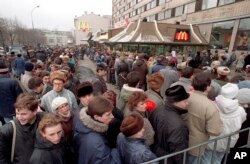 FILE - Hundreds of people line up outside the first McDonald's restaurant in the Soviet Union on its opening day, in Moscow, Jan. 31, 1990.