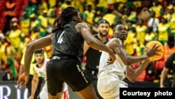 FILE - Guinea's Seydou Legacy Athlétique Club (SLAC) plays against Rwanda Energy Group (REG) in a BAL game, Dakar, Senegal, March 9, 2022. (Courtesy photo: BAL)