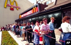 FILE - Russians wait in line outside a McDonald's fast food restaurant in Moscow in 1991.