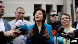 FILE - Turkish broadcast journalist Sedef Kabas speaks to the media after her trial on Oct. 6, 2015, in Istanbul.