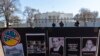 Signs and pictures of those killed, including journalist Brent Renaud, are displayed on a fence during a protest against Russia's invasion of Ukraine in Lafayette Park near the White House, Sunday, March 13, 2022, in Washington. 