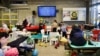 Kids Play Area Set up at a Warsaw railway station; the television is showing Ukrainian cartoons. (Jamie Dettmer/VOA)