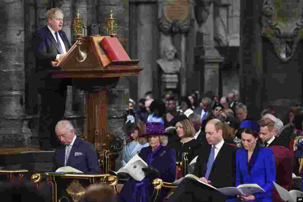 Britain&#39;s Prime Minister Boris Johnson delivers a speech as Prince Charles, left, Camilla, Duchess of Cornwall, Prince William and Kate, Duchess of Cambridge, right, attend the Commonwealth Service on Commonwealth Day at Westminster Abbey in London.