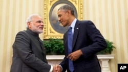 President Barack Obama shakes hands with Indian Prime Minister Narendra Modi, Tuesday, Sept. 30, 2014, in the Oval Office of the White House in Washington.