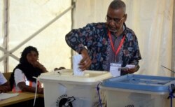 Presidential candidate for Alliance for Change and Transparency, Seif Sharif Hamad, casts his vote in Zanzibar Tanzania, Oct.28, 2020.