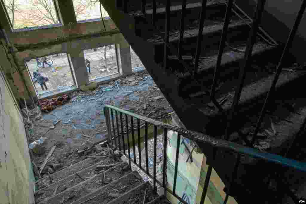 Part of the stairs in a residential building collapsed after a missile struck the area in Kyiv, Ukraine, March 14, 2022. 