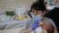 Nurse Oksana Martynenko looks after surrogate born babies inside a special shelter owned by BioTexCom clinic in a residential basement, on the outskirts of Kyiv, Ukraine, March 15, 2022.