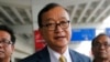 FILE - Cambodia's exiled opposition leader Sam Rainsy talks to the media upon arrival at Soekarno-Hatta International Airport in Tangerang, Indonesia on Nov. 14, 2019. 