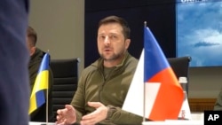 Ukrainian President Volodymyr Zelenskyy speaks in Kyiv, Ukraine, March 15, 2022, in this image from video provided by the Ukrainian Presidential Press Office.