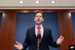 Sen. Ben Sasse, R-Neb., speaks with reporters after watching a speech by Ukrainian President Volodymyr Zelenskyy live-streamed into the U.S. Capitol, in Washington, March 16, 2022.