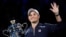 FILE - Ash Barty of Australia waves as she holds the Daphne Akhurst Memorial Cup after defeating Danielle Collins of the U.S., in the women's singles final at the Australian Open tennis championships in Melbourne, Australia on Jan. 29, 2022.