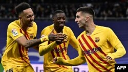 Les joueurs barcelonais lors de leur victoire contre le Real Madrid, Espagne, le 20 mars.