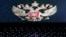 FILE - The coat of arms of Russia is reflected in a laptop screen in this illustration photo taken Feb. 12, 2019.