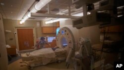 Charlie Stroiney, 8, is prepped for an MRI during a long day of testing at Children's National Hospital, in Washington, Jan. 26, 2022.