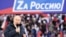 Russian President Vladimir Putin delivers a speech during a rally at Luzhniki Stadium in Moscow, March 18, 2022. The banner reads: "For Russia," using the untraditional "Z" representative of Russia's campaign in Ukraine. (Sputnik/Kremlin via Reuters)