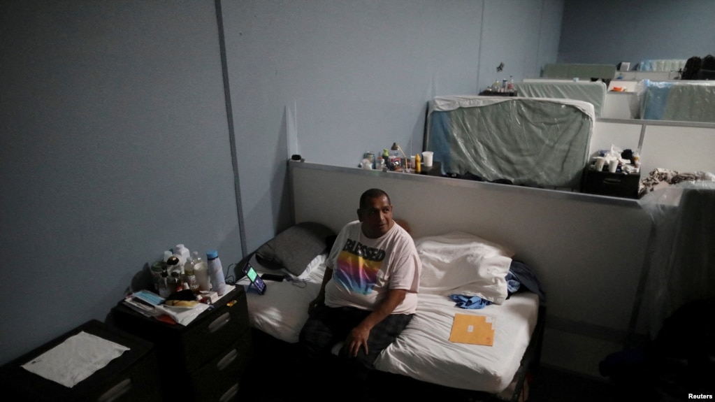 FILE - Roland Flores, 48, sits on a bed at the Fullerton Navigation Center, a homeless shelter in Fullerton, California, U.S. March 11, 2022. (REUTERS/David Swanson/File Photo)