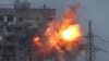 An explosion in an apartment building that came under fire from a Russian army tank in Mariupol, Ukraine, March 11, 2022.