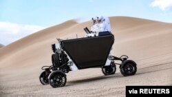 A handout image shows a prototype of California startup Astrolab 's Flex rover, that will be able to be operated directly by astronauts on the moon. The rover was tested in Death Valley National Park at the Dumont Dunes in December, 2021. (ASTROLAB/Handout)