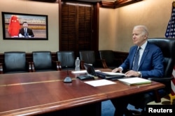 U.S. President Joe Biden holds virtual talks with Chinese President Xi Jinping from the Situation Room at the White House in Washington, March 18, 2022. (The White House/Handout via Reuters).