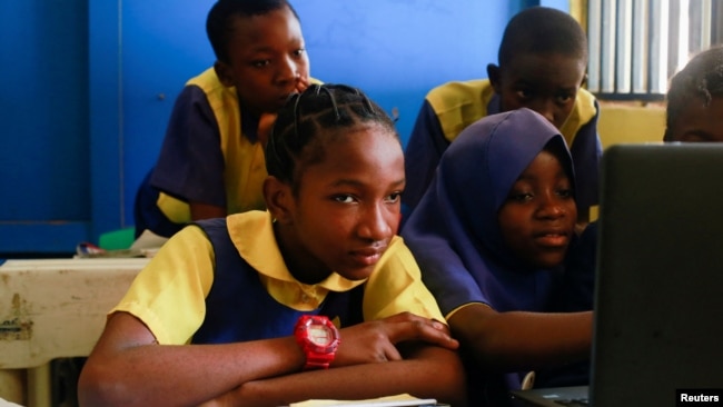 Faridat Bakare, 12, a student enrolled in a special STEM program for children from poor families at the Knosk Secondary School in Kuje, Abuja, Nigeria February 18, 2022. (REUTERS/Afolabi Sotunde)