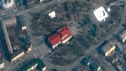 This satellite image provided by Maxar Technologies shows the Mariupol Drama Theater in Mariupol, Ukraine, March 14, 2022. Ukrainian officials say Russian forces destroyed the theater where hundreds of people were sheltering. There was no immediate word o