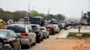 FILE - Motorists queue to buy fuel at a filling station following a fuel shortage and causing traffic gridlock in Lagos, Nigeria, on March 3, 2022.