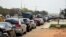 FILE - Motorists queue to buy fuel at a filling station following a fuel shortage and causing traffic gridlock in Lagos, Nigeria, on March 3, 2022.