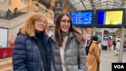 Mother-daughter film directors Maria and Anastasia Starozhitska, who fled their home in Kyiv and have just arrived in Paris. (Lisa Bryant/VOA)