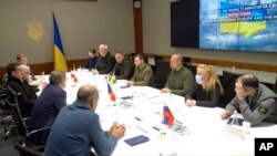 FILE - Ukrainian President Volodymyr Zelenskyy speaks during a meeting with Czech Republic Prime Minister Petr Fiala and others in Kyiv, Ukraine, March 15, 2022, in this image from video provided by the Ukrainian Presidential Press Office.