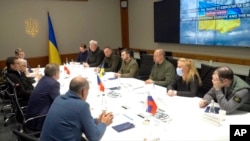 Ukrainian President Volodymyr Zelenskyy speaks during a meeting in Kyiv, Ukraine, March 15, 2022, in this image from video provided by the Ukrainian Presidential Press Office.